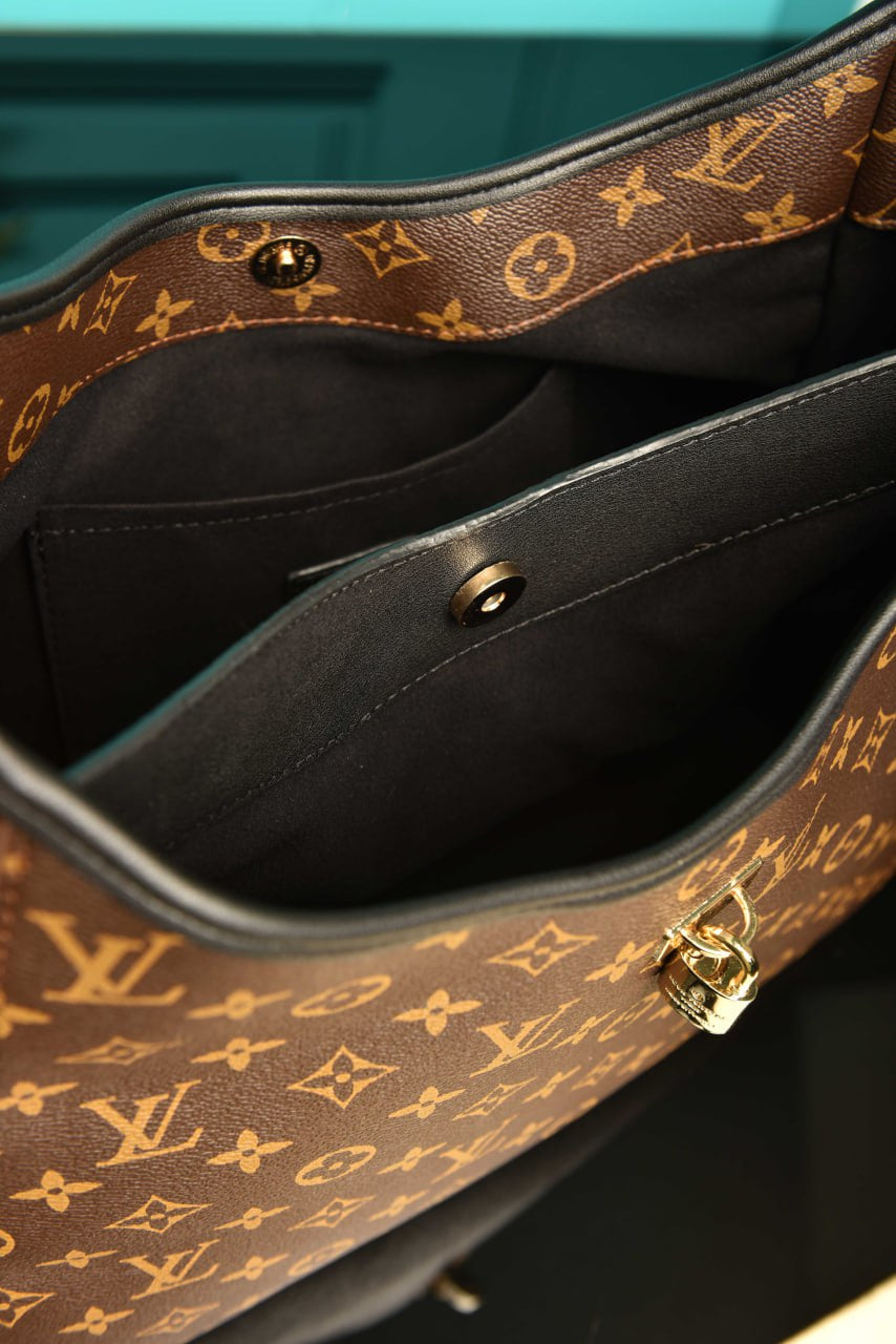 LOUIS VUITTON THE DROP GM